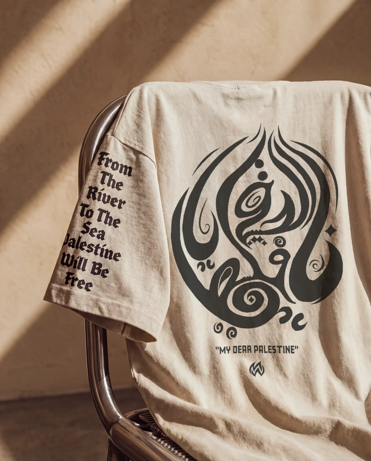 Back of the beige tee, MY DEAR PALESTINE across the whole back in Arabic calligraphy